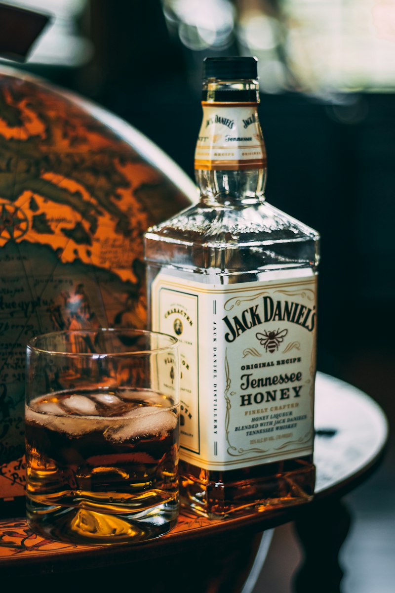 Real photograph of premium whisky bottle and crystal tumbler