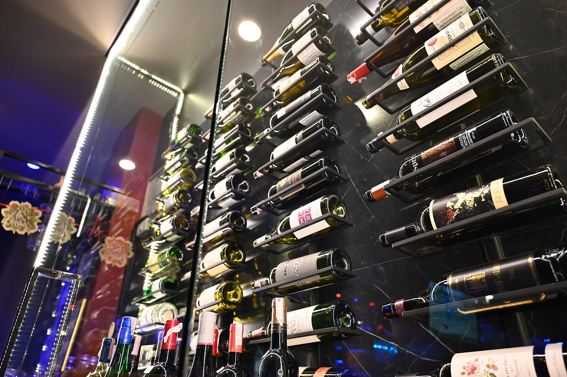 Living Liquidz store display with illuminated spirit collection